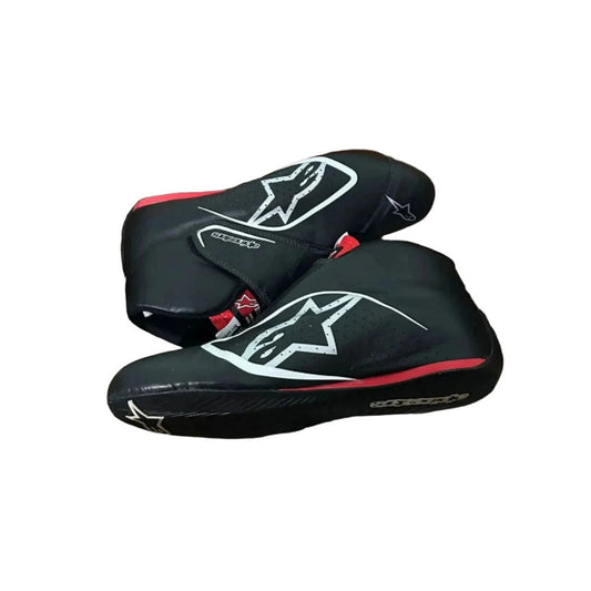Black Carlos Sainz 2017 F1 race shoes with a logo on a white background