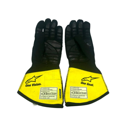 Pair of black and yellow Lance Stroll 2020 F1 Race gloves with visible branding on a white background