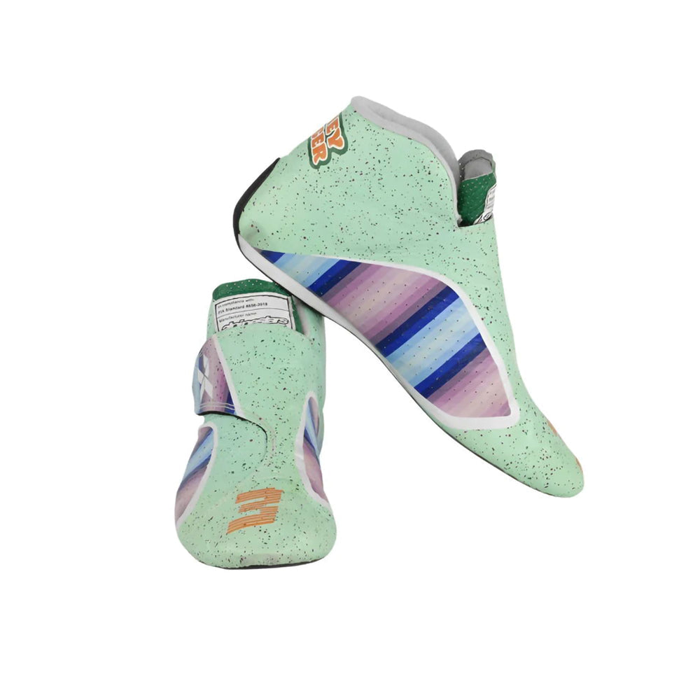 Pair of green Daniel Ricciardo 2021 Honey Badger F1 Racing shoes with colorful stripes on a white background