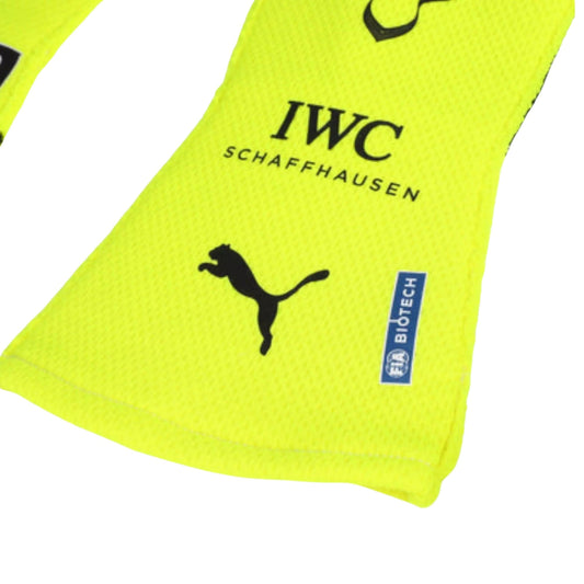 Yellow Lewis Hamilton 2023 F1 Race glove with Puma logo and 'IWC Schaffhausen' text on a white background