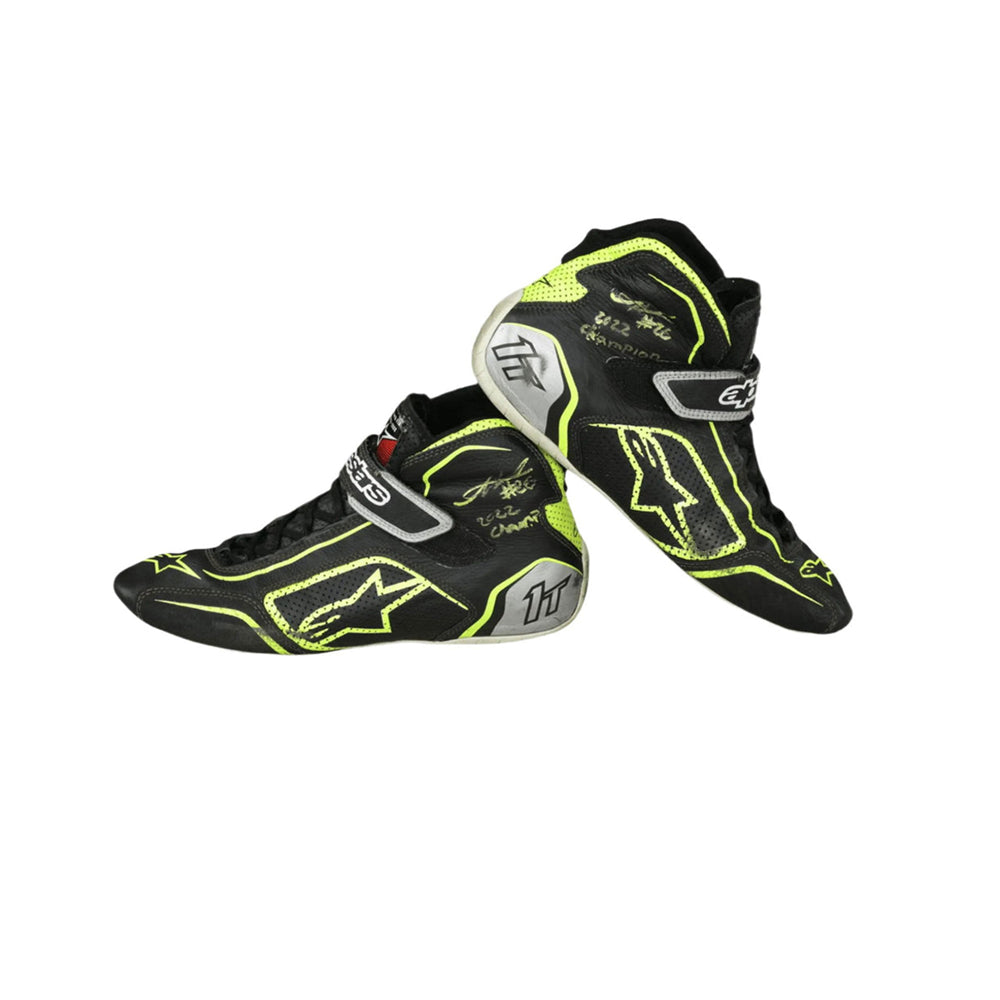 Black and yellow Linus Lundqvist Championship HMD 2022 Indy Lights racing boots on a white background