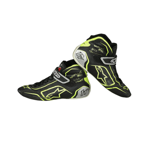 Black and yellow Linus Lundqvist Championship HMD 2022 Indy Lights racing boots on a white background