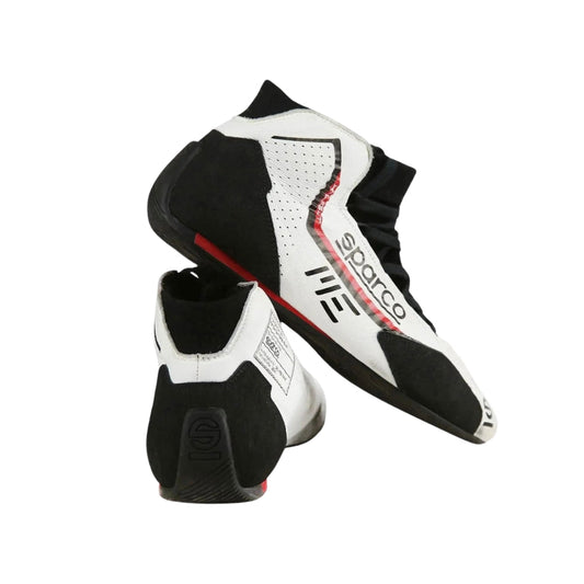 Black and white Marcus Ericsson 2021 Indy 500 Race shoes with 'Spektrum' branding on a white background