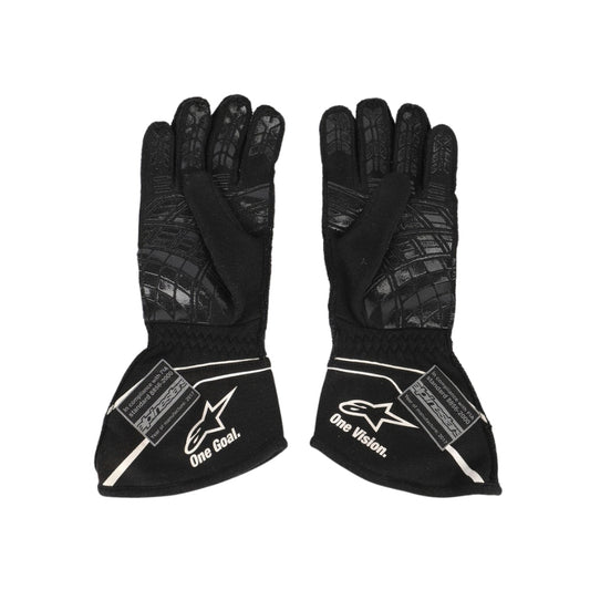Pair of black Nico Hülkenberg 2017 F1 race gloves with visible branding on a white background