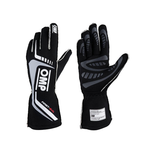 Pair of black and gray OMP First-EVO Race gloves with OMP branding on a white background