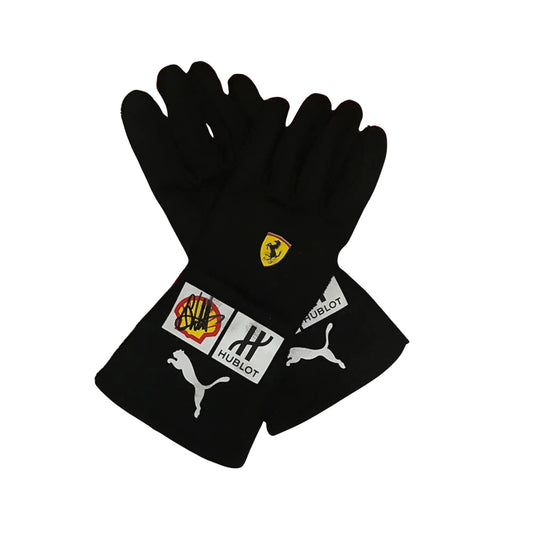 Black Sebastian Vettel 2018 F1 race gloves with sponsor logos on a white background