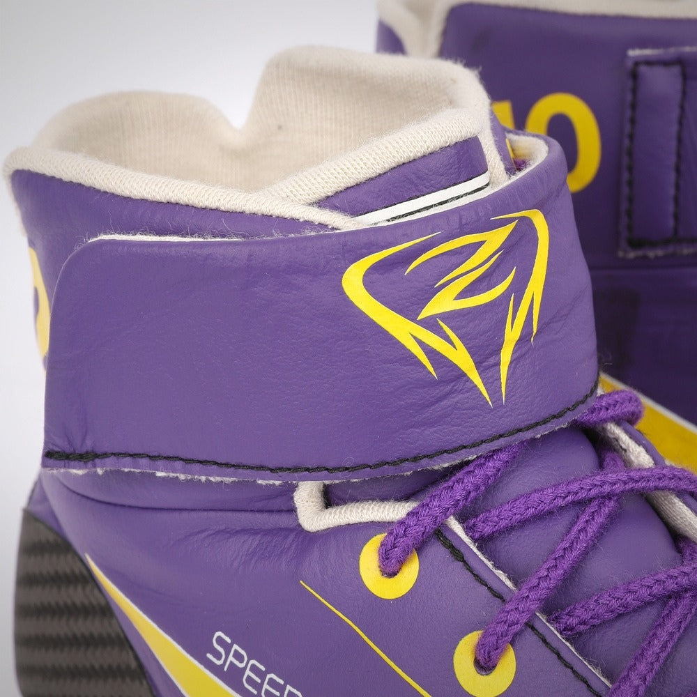 Close-up of purple Zhou Guanyu 2023 Mexico City GP F1 Race shoes with yellow accents on a white background
