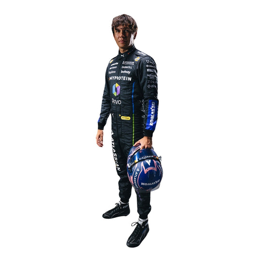 Alexander wearing a 2025 las vegas racing suit holding a helmet on a white background