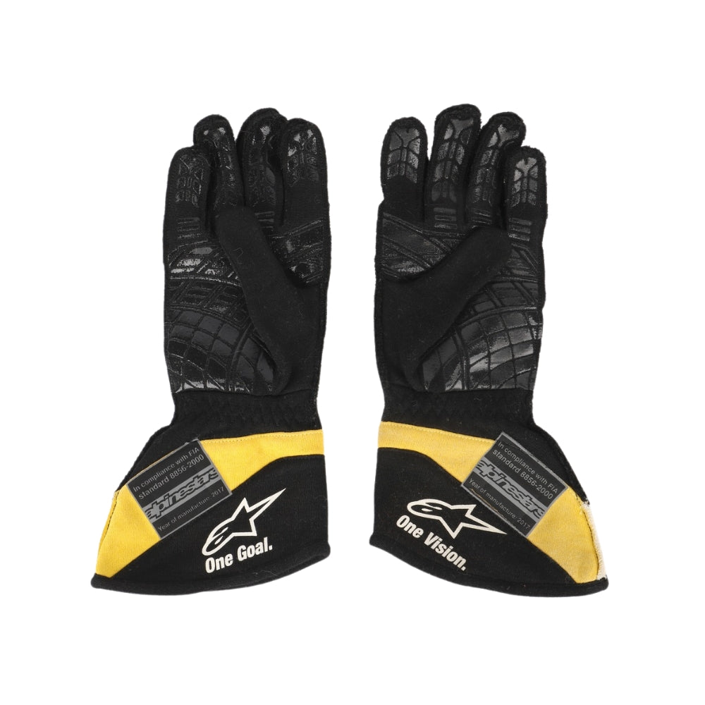 Black and yellow Carlos Sainz 2017 F1 race gloves with branding on a white background