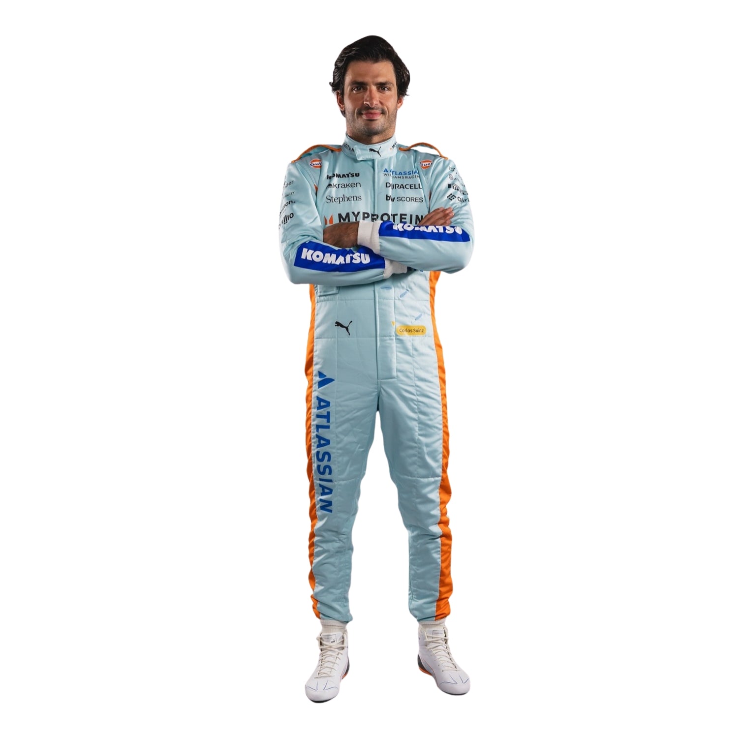 Carlos wearing a light blue racing suit with various sponsor logos on a white background
