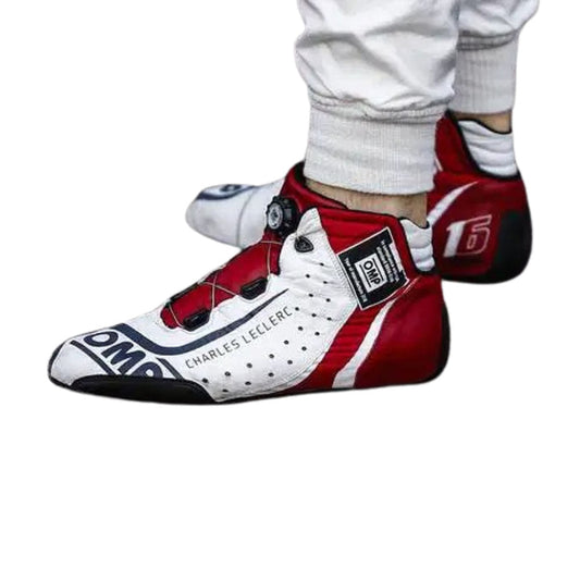 Red and white Charles Leclerc 2018 F1 race shoes with visible branding on a white background