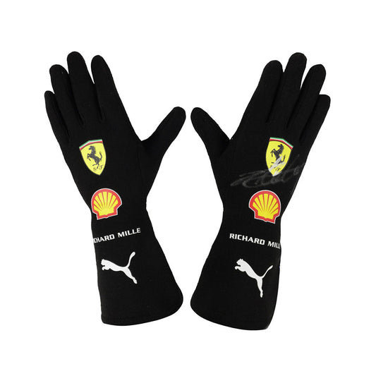 Black Charles Leclerc 2022 F1 race gloves with Ferrari, Shell, and Puma logos on a white background