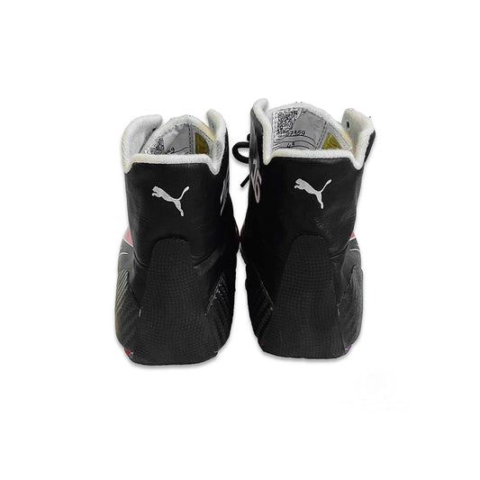 Black high-top Charles Leclerc 2022 F1 Race shoes with white soles on a white background