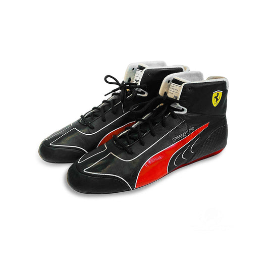 Black and red Charles Leclerc 2022 F1 Race shoes with a Ferrari logo on a white background