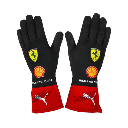 Black and red Charles Leclerc 2023 F1 race gloves with Ferrari and Shell logos on a white background 