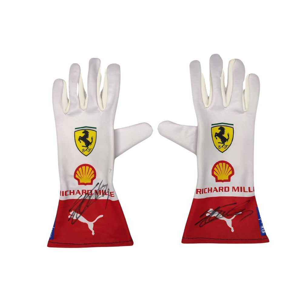 Pair of white Charles Leclerc 2023 Monaco GP F1 Race gloves with Ferrari and Shell logos on a white background