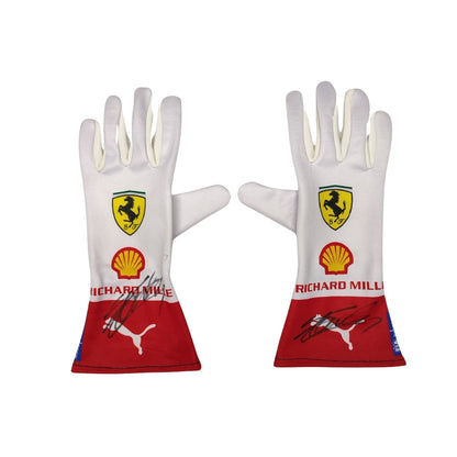 Pair of white Charles Leclerc 2023 Monaco GP F1 Race gloves with Ferrari and Shell logos on a white background