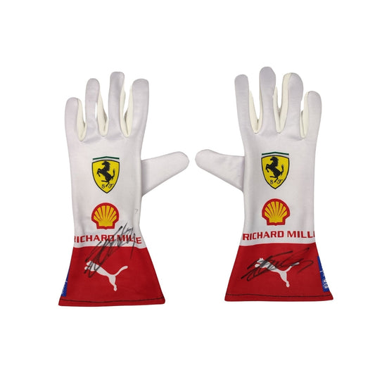 Pair of white Charles Leclerc 2023 Monaco GP F1 Race gloves with Ferrari and Shell logos on a white background
