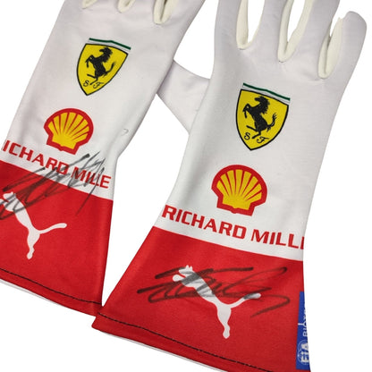 Pair of white Charles Leclerc 2023 Monaco GP F1 Race gloves with Ferrari, Shell, and Richard Mille logos on a white background