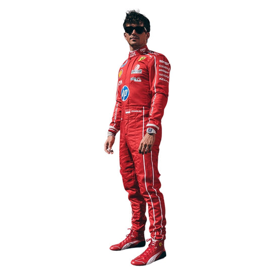 A Charles Leclerc wearing a red full-body racing suit with white side stripes and multiple sponsor logos, along with matching red racing shoes and dark sunglasses, standing against a plain white background.