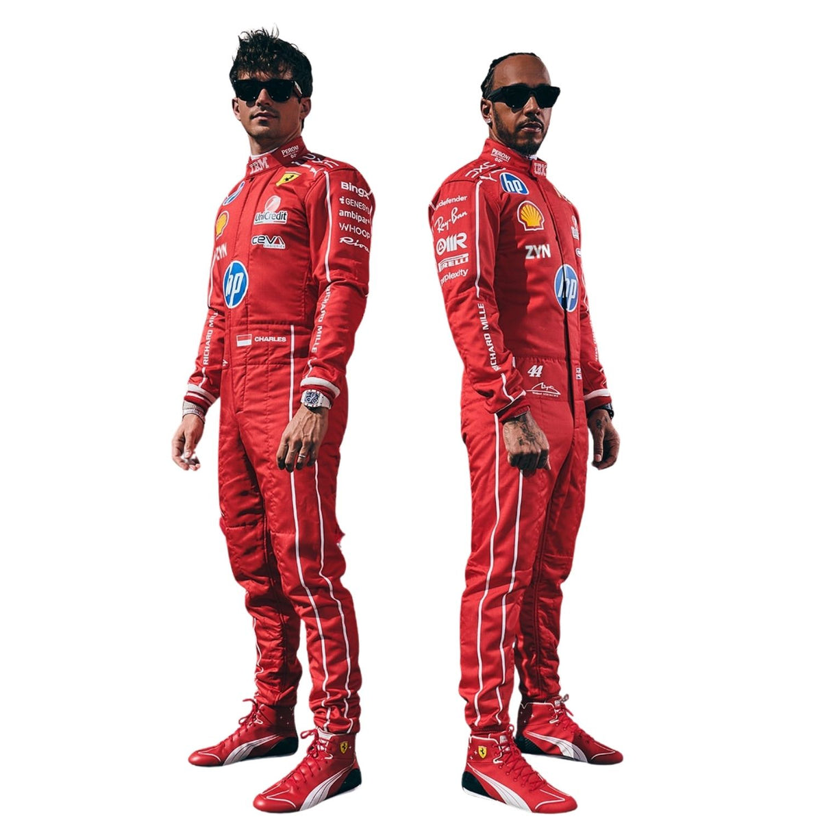 Two men wearing matching red Ferrari racing suits and red Ferrari racing shoes, standing in profile against a plain white background. One wears sunglasses, and both suits feature visible sponsor logos including HP, Shell, and Castor.