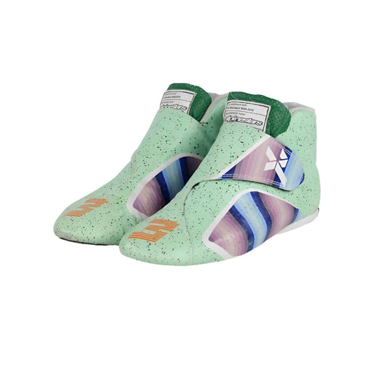 Pair of green Daniel Ricciardo 2021 Honey Badger F1 Racing athletic shoes with colorful sole designs on a white background