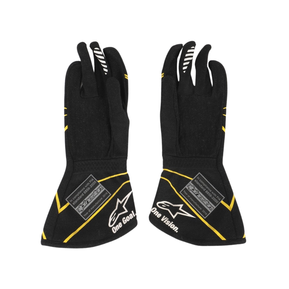 Black Esteban Ocon 2016 F1 race gloves with yellow accents and brand logos on a white background