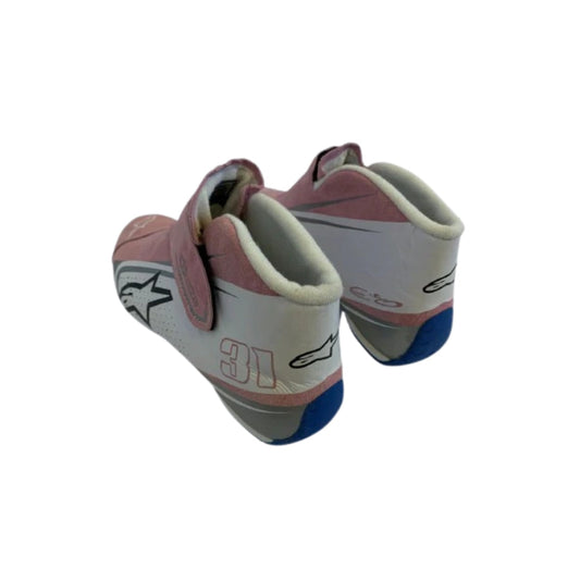 Pair of pink and white Esteban Ocon 2018 F1 Race shoes with number 31 on a white background