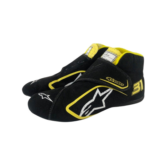 Black and yellow Esteban Ocon 2020 Tuscan GP F1 Race shoes with a prominent logo on a white background