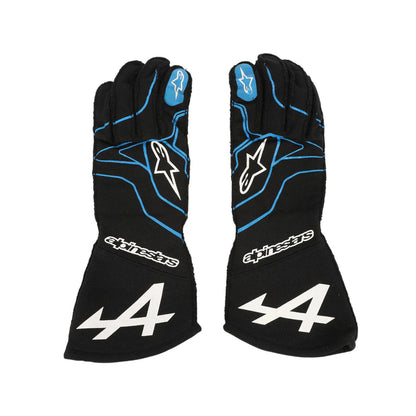 Pair of black Esteban Ocon 2021 F1 race gloves with blue accents and an Alpinestars logo on a white background