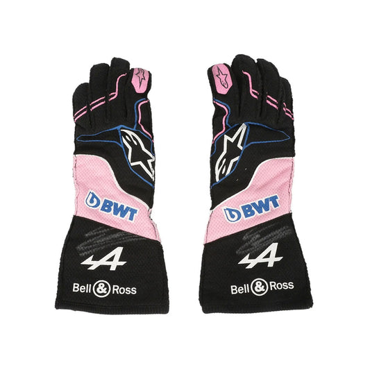 Pair of black and pink Esteban Ocon 2023 Miami GP F1 Race gloves with branding on a white background