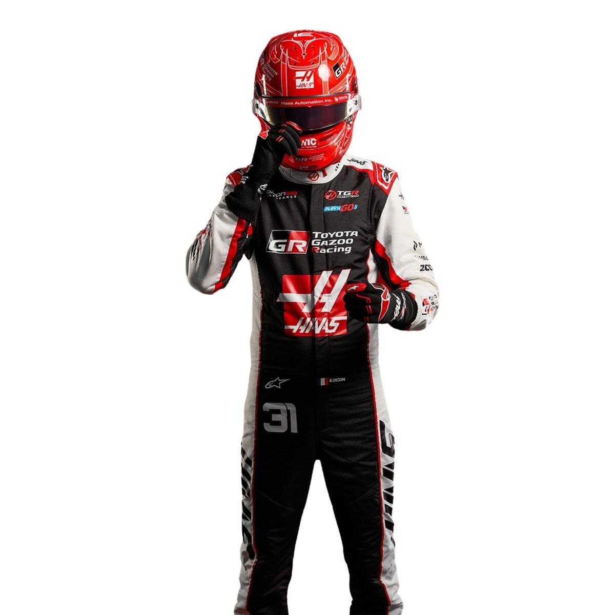 Esteban Ocon wearing a Haas racing suit with various sponsor logos with Close View