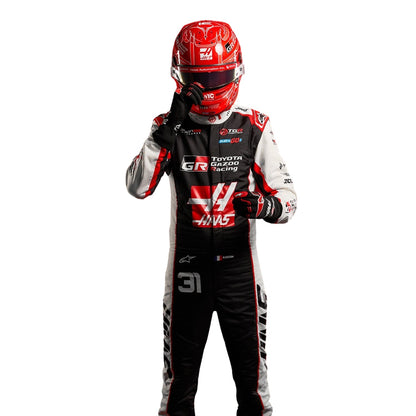 Esteban Ocon wearing a Haas racing suit with various sponsor logos with Close View