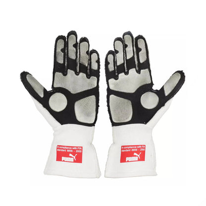 Pair of white and black Fernando Alonso 2010 Japanese GP F1 race gloves with Puma branding on a white background