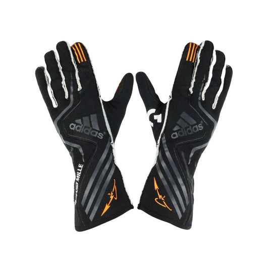 Pair of black Adidas Fernando Alonso 2017 F1 Race gloves with orange accents on a white background