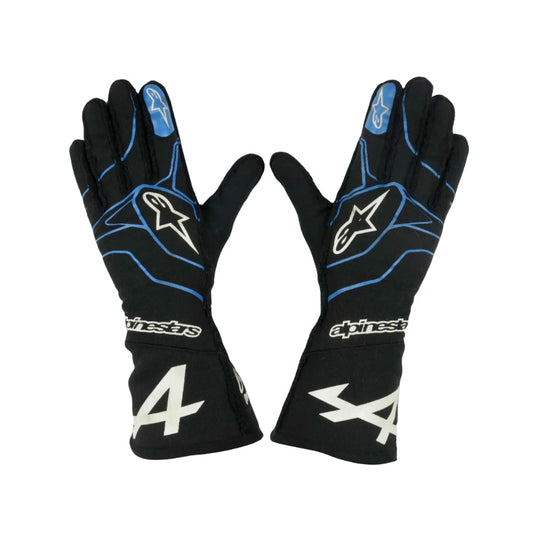 Black Fernando Alonso 2021 F1 race gloves with blue accents and Alpinestars logo on a white background