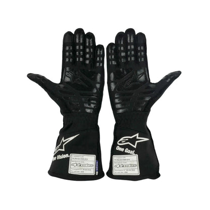 Pair of black Fernando Alonso 2021 F1 race gloves with visible branding on a white background
