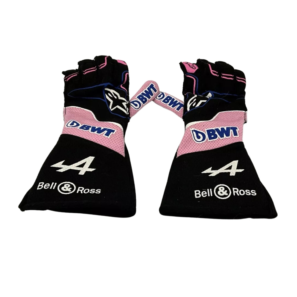 Pair of black and pink Fernando Alonso 2022 F1 Race gloves with branding on a white background