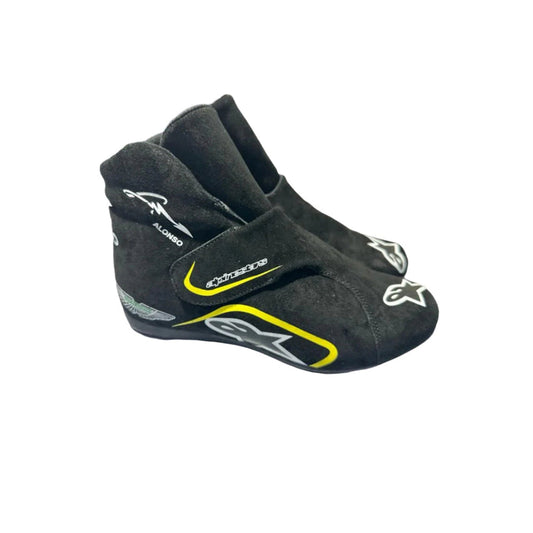 Black Fernando Alonso Aston Martin 2023 F1 race shoes with visible branding on a white background