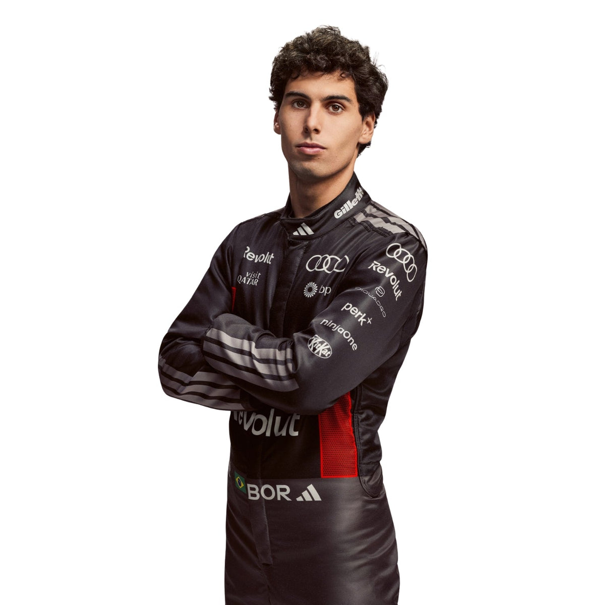 Gabriel Bortoleto wearing a Audi racing suit with various sponsor logos with Close View