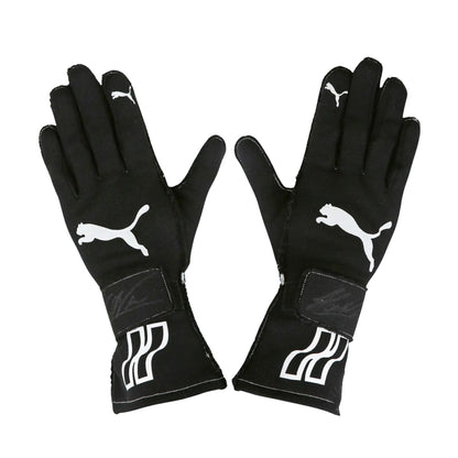 Pair of black Helio Castroneves 2017/18 IndyCar IMSA race gloves with Puma logo on a white background