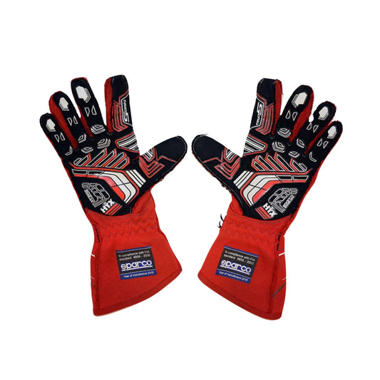 Red and black James Hinchcliffe 2018 IndyCar race gloves with Sparco branding on a white background