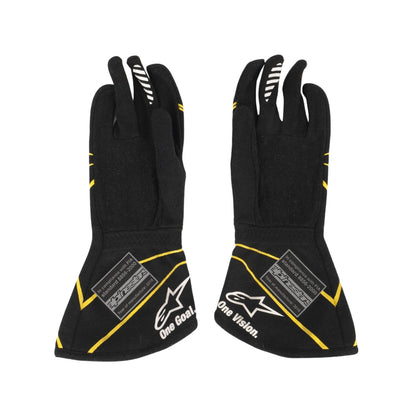 Kevin Magnussen 2016 Black F1 race gloves with yellow accents and visible branding on a white background