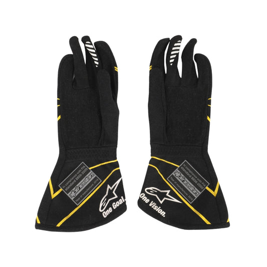 Kevin Magnussen 2016 Black F1 race gloves with yellow accents and visible branding on a white background