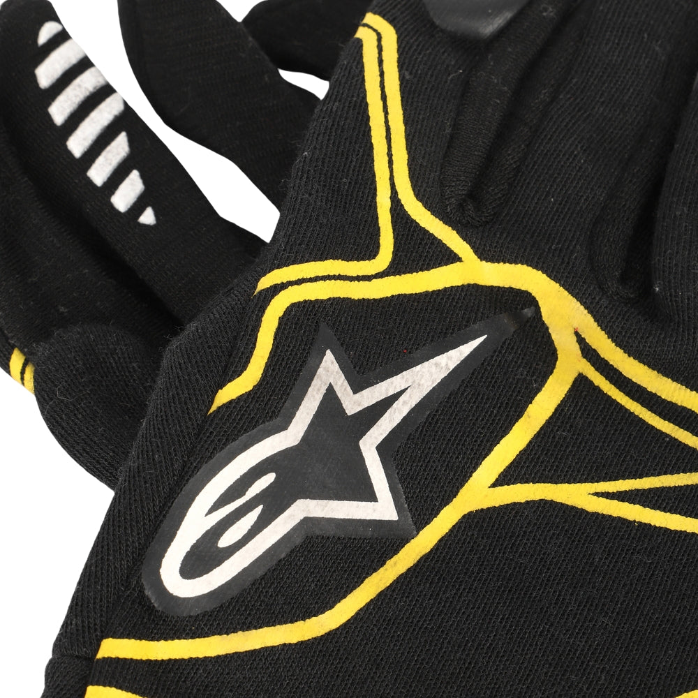 Kevin Magnussen 2016 Black F1 Race glove with yellow accents and a star logo on a white background