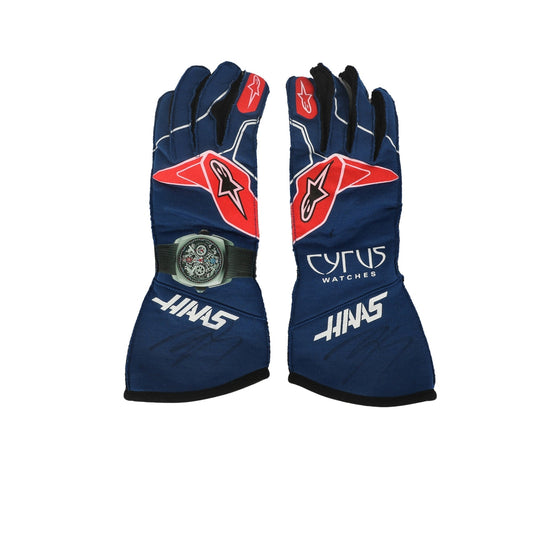 Pair of blue Kevin Magnussen 2022 F1 race gloves with red and white accents on a white background