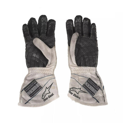 Pair of black and gray Lance Stroll 2017 F1 Race gloves with visible branding on a white background