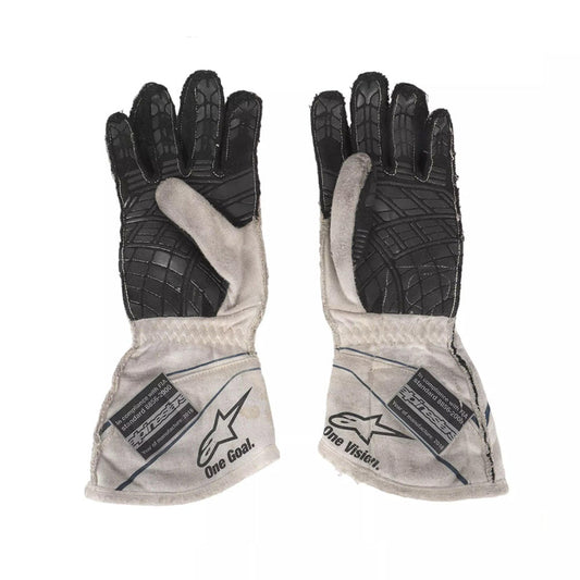Pair of black and gray Lance Stroll 2017 F1 Race gloves with visible branding on a white background