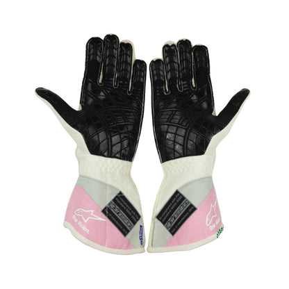 Pair of black and white Lance Stroll 2019 F1 Race gloves with pink accents on a white background