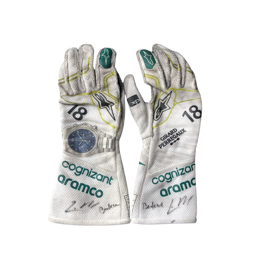 Pair of Lance Stroll 2023 Baku Worn F1 race gloves with sponsor logos on a white background